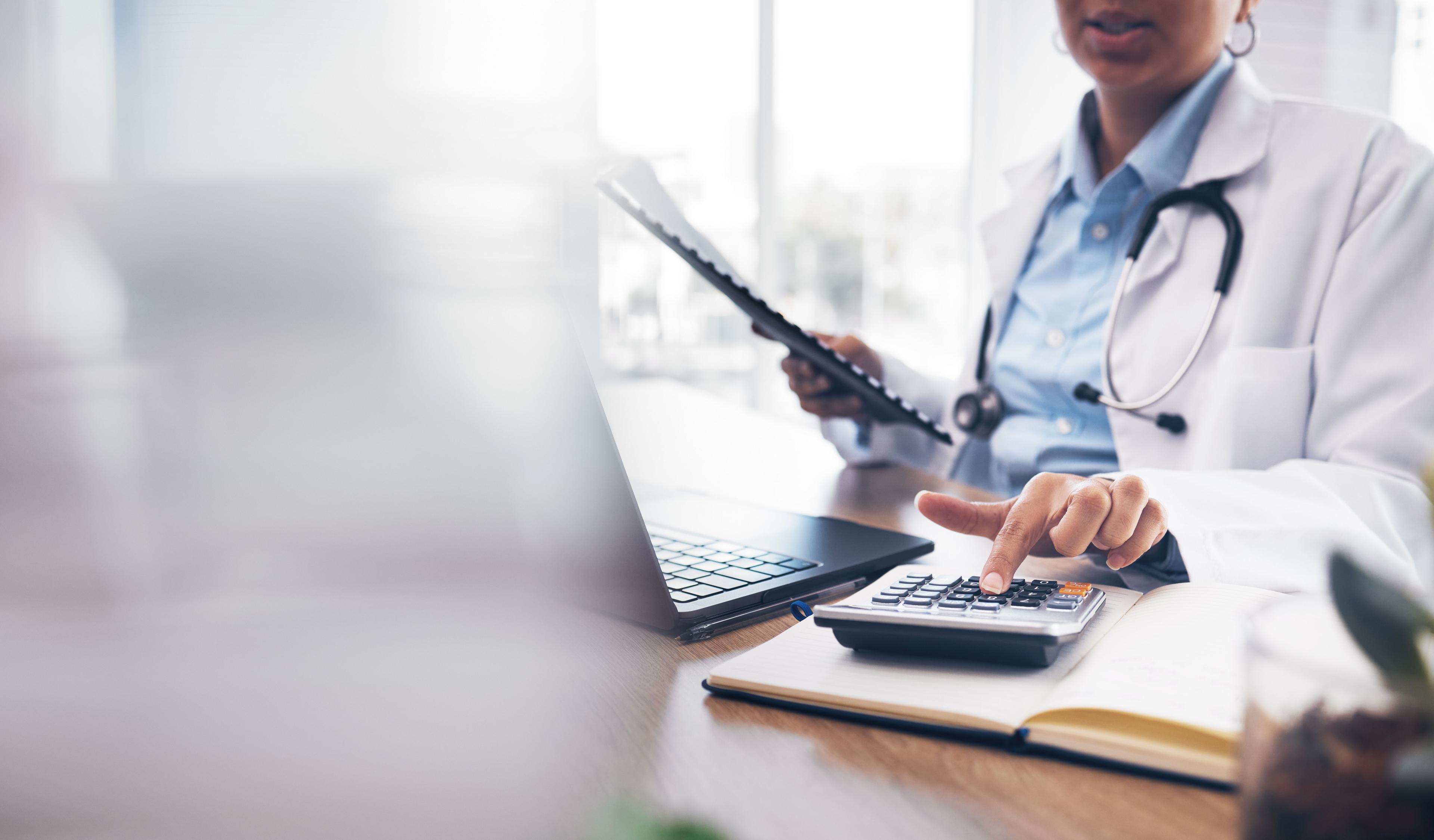 doctor calculating biosimilar savings | Image credit: Mumtaaz D/peopleimages.com - stock.adobe.com