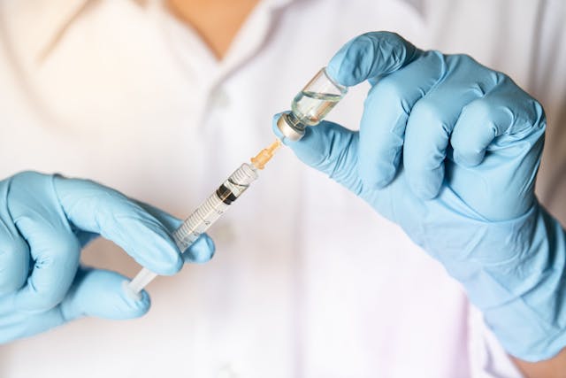 Doctor filling syringe | Image credit: PhotobyTawat - stock.adobe.com